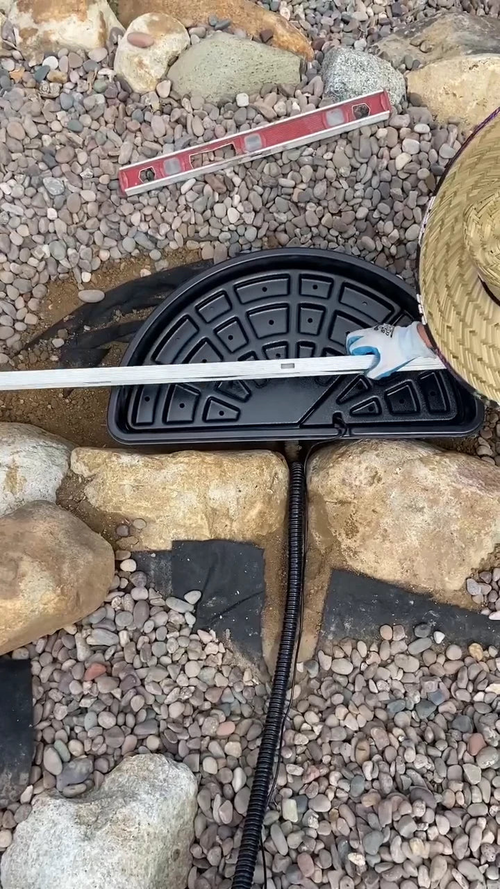 A tape measure laid across the basin in the creator’s rock-lined garden corner.